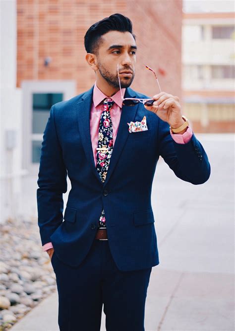 navy suit with pink shirt.